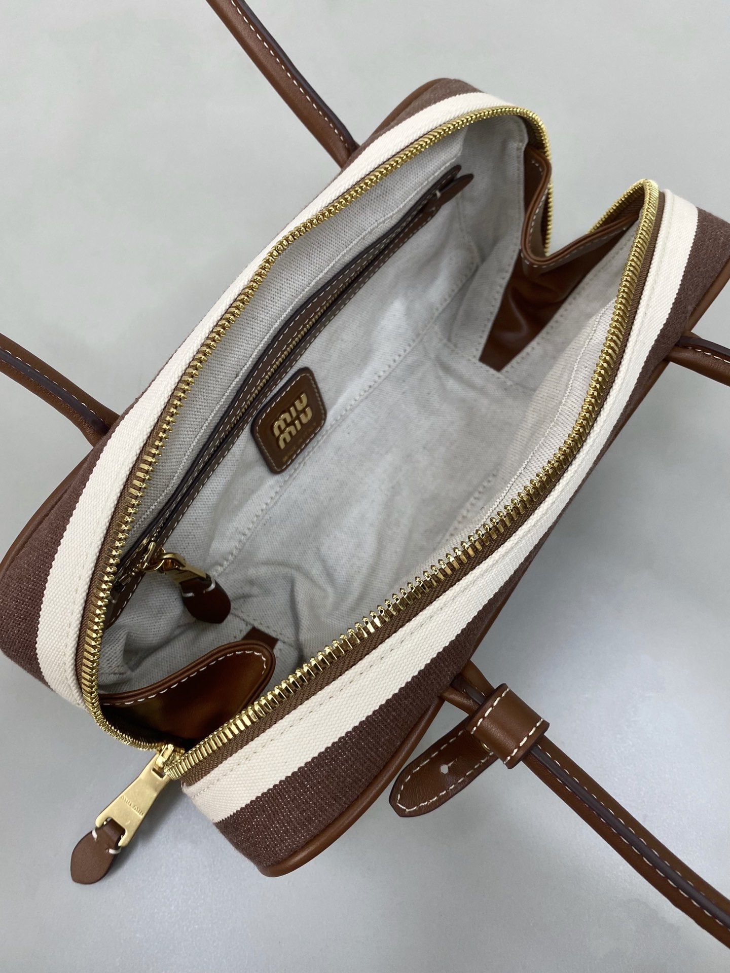 M1um1u beau top-handle tratan bag -27×12×9cm